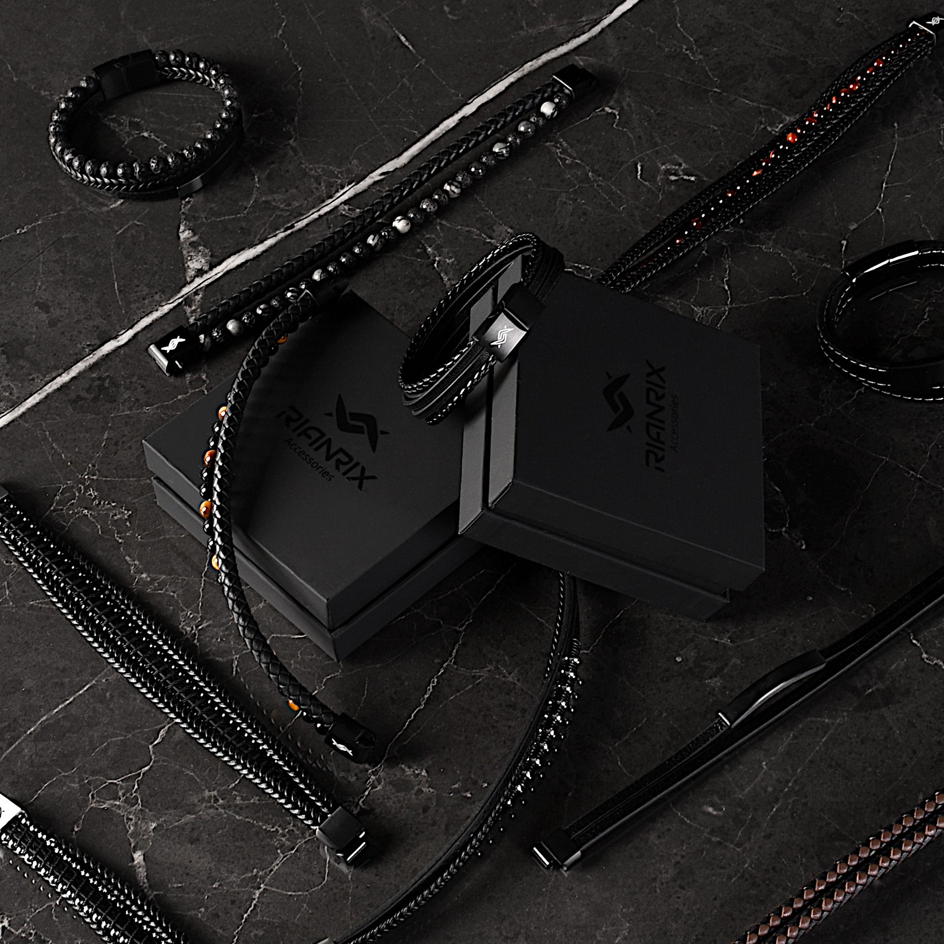 Showing a collection of men's leather bracelets around Rianrix giftbox, top view