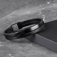 Multi-layer leather bracelet with black matte tube and black 316L stainless steel clasp, front view