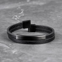 Multi-layer leather bracelet with black matte tube and black 316L stainless steel clasp, front view